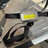 Red light torch with body strap